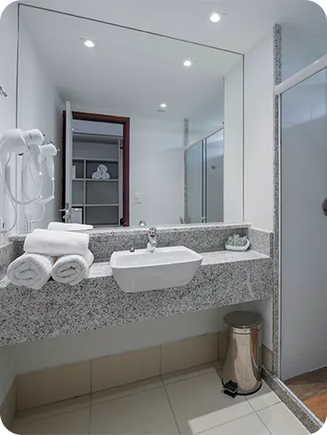 First-floor balcony of the Family Suite, with two chairs and a pool view.