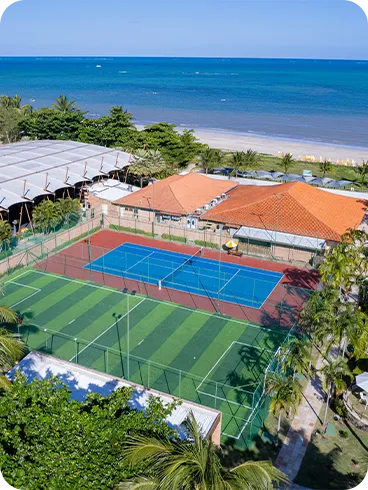 Aerial view of the sports courts and leisure facilities at Salinas Maragogi, with ocean views