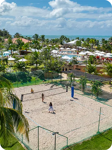 Aerial view of the sand volleyball courts and leisure area at Salinas Maragogi, overlooking the pool and ocean