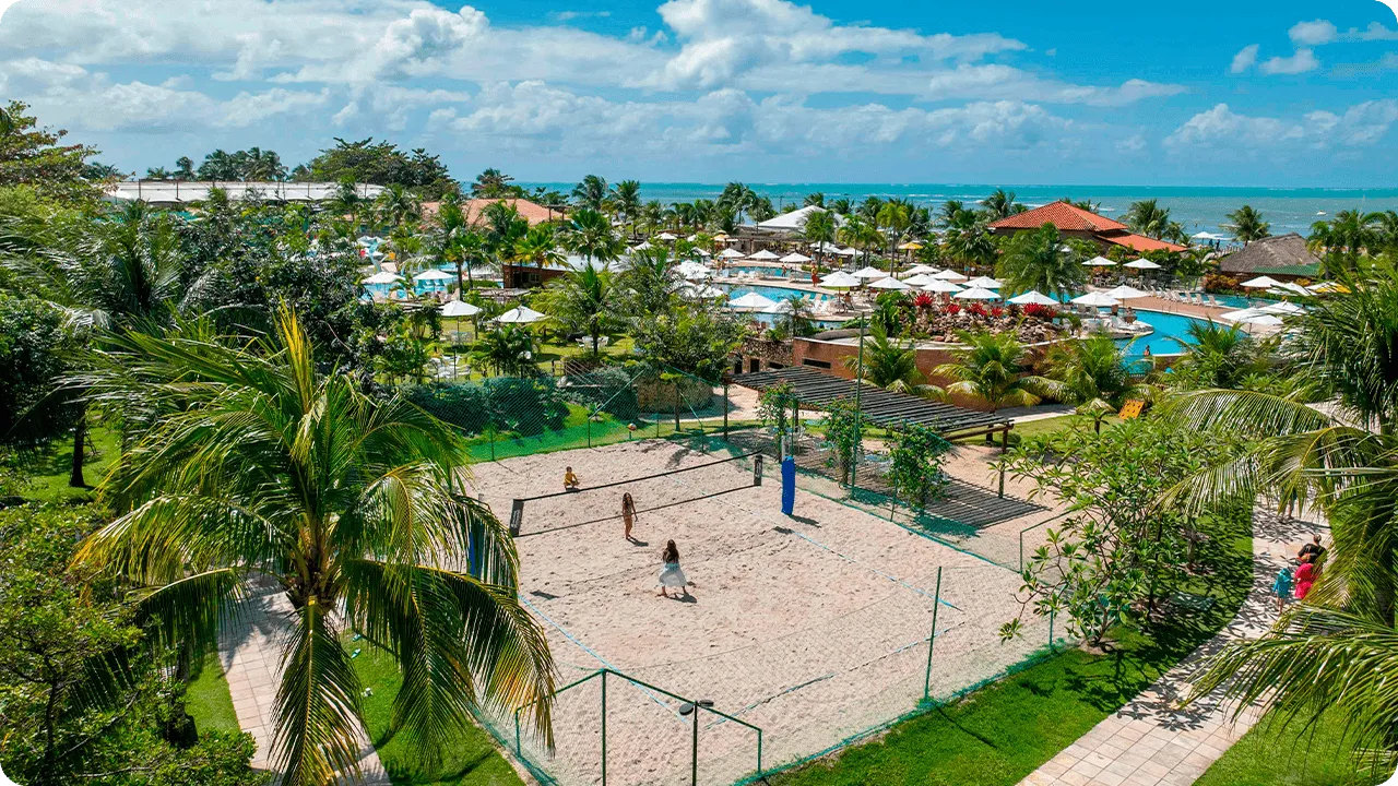 Aerial view of the sand volleyball courts and leisure area at Salinas Maragogi, overlooking the pool and ocean