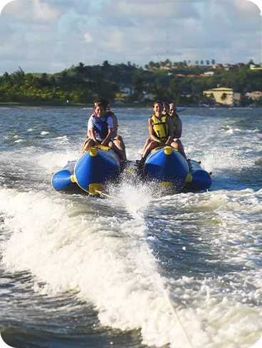 Tourists enjoying a banana boat ride in the Maragogi waters.