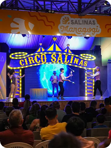 Circus show with jugglers and audience on stage at the Salinas Maragogi All Inclusive Resort